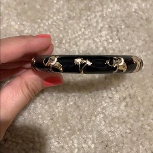 Black/gold bracelet with elephant detai